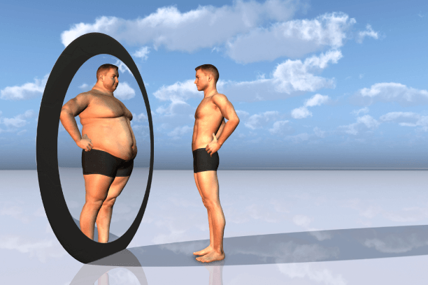 A very lean and thin person- appearing fat in mirror A very lean and thin person- appearing fat in mirror