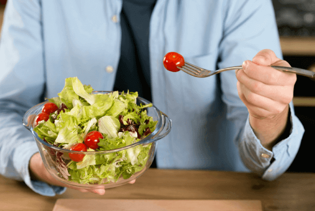 Nutrify your diet Man eating salad